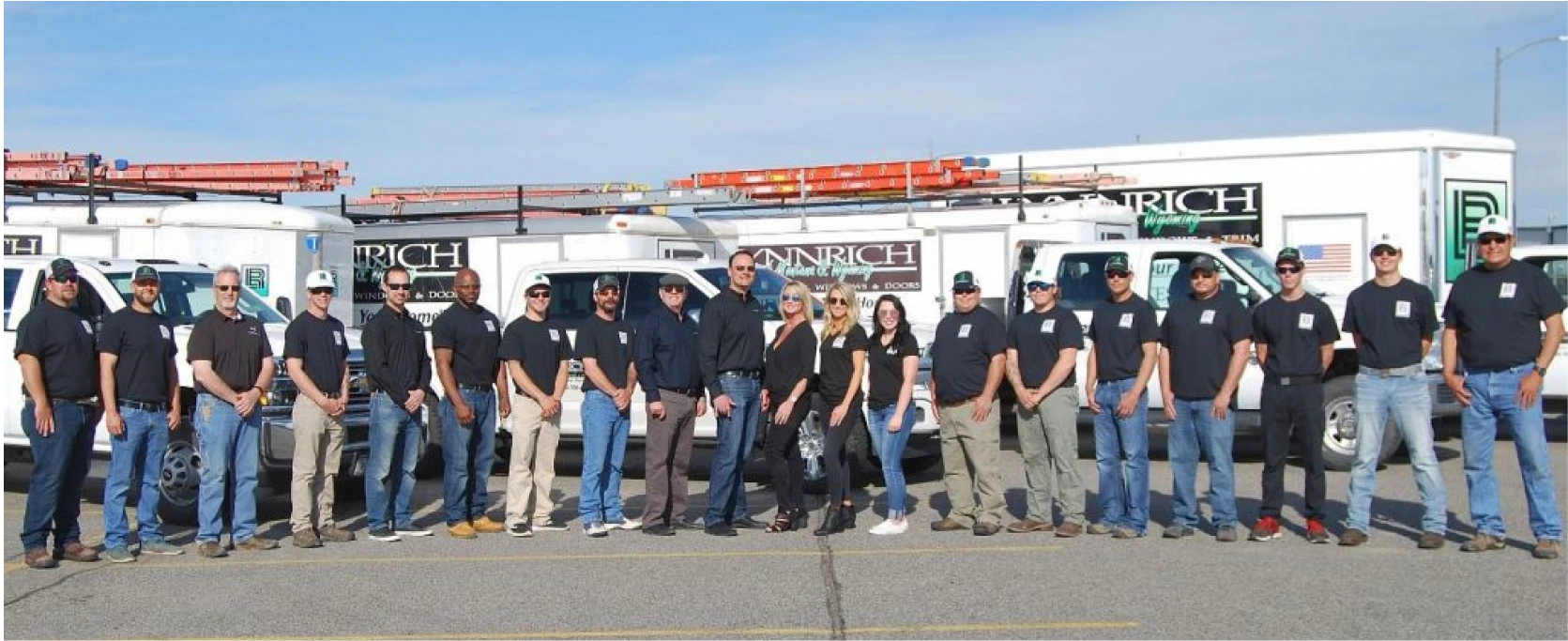 a group of people standing in front of a truck