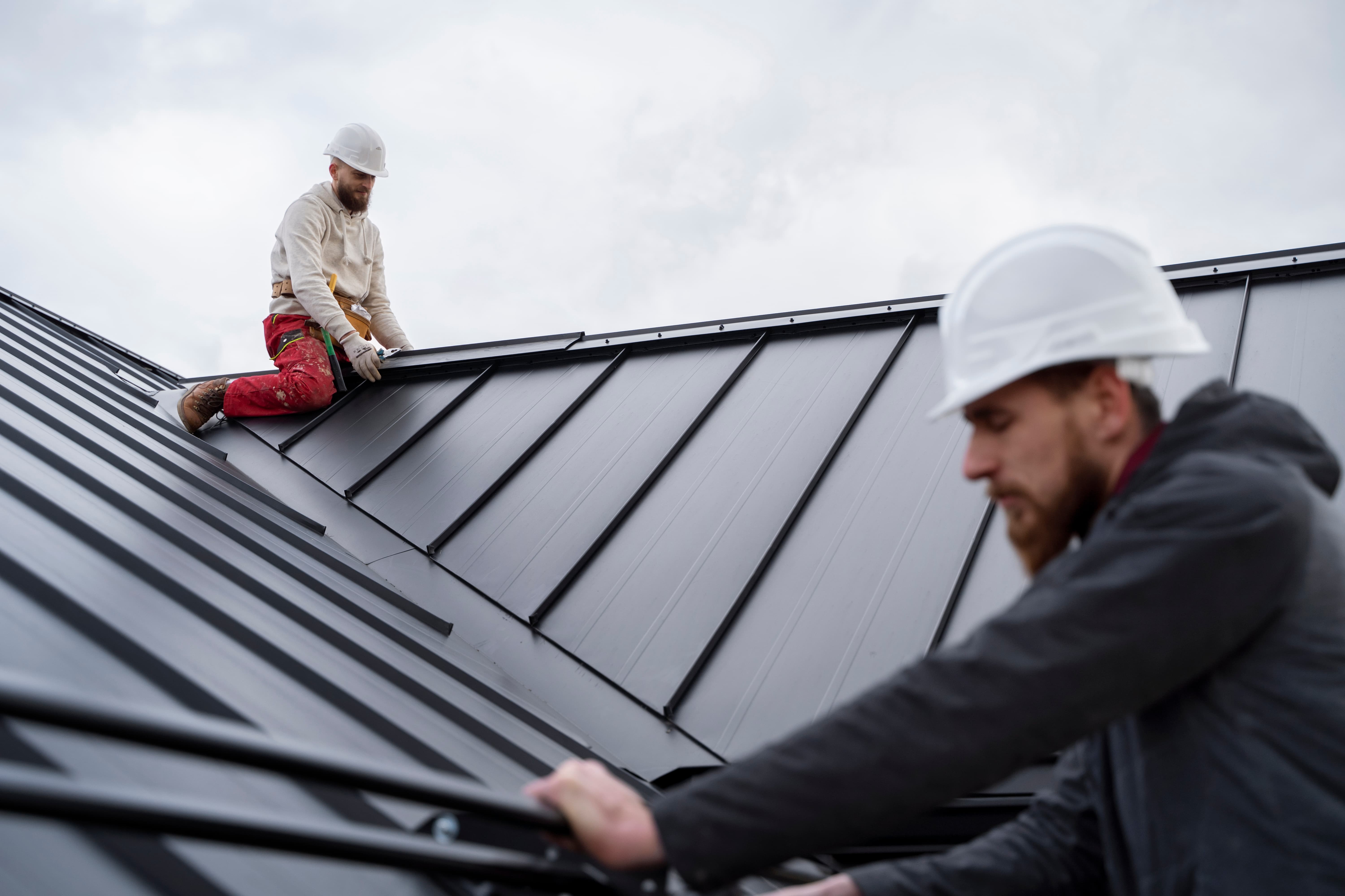 medium shot men working roof 1 Lynnrich